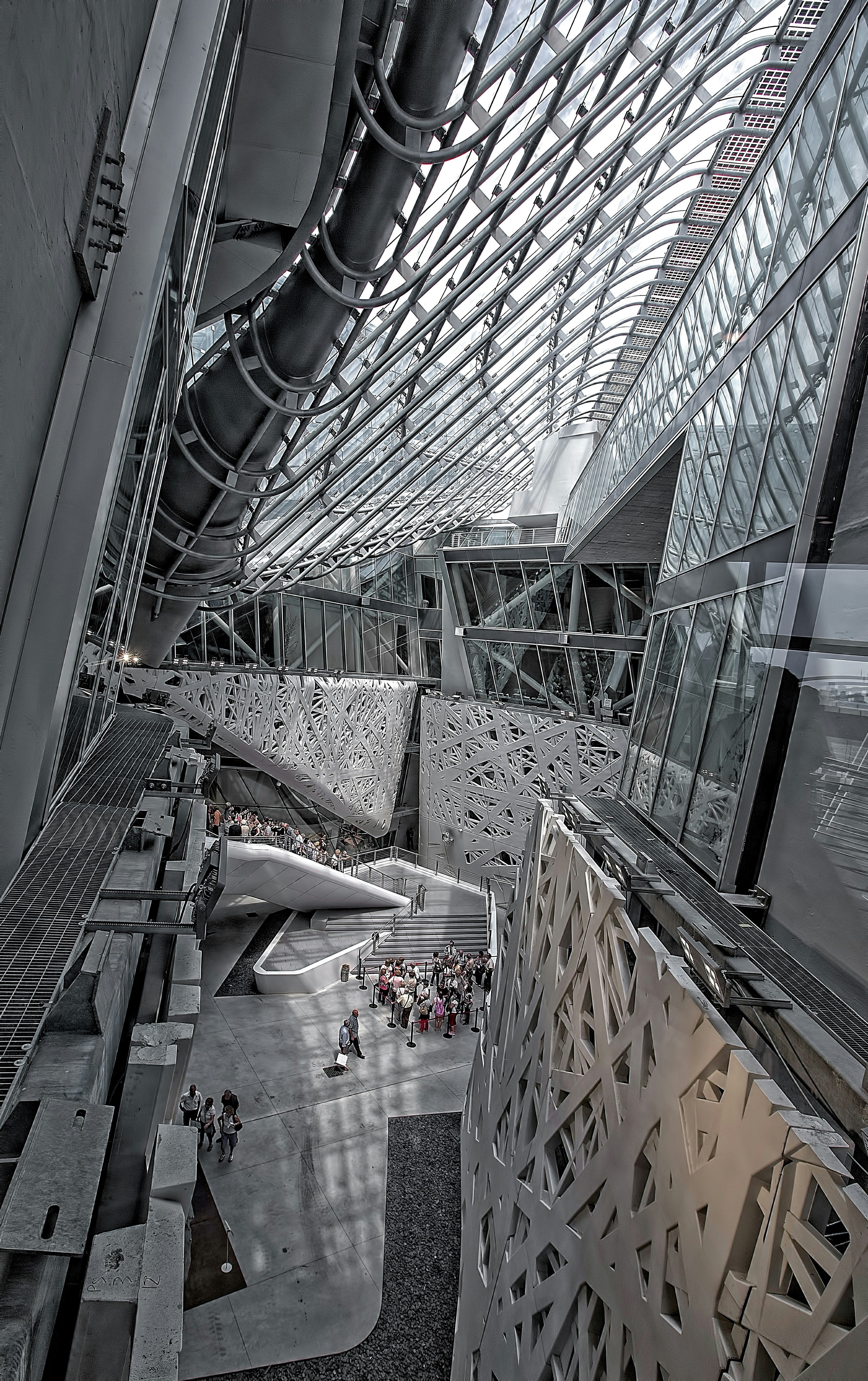 grayscale photography of people inside building